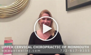 Woman smiling in room at Upper Cervical Chiropractic of Monmouth NJ