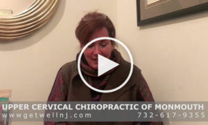 Woman talking in room at Upper Cervical Chiropractic of Monmouth