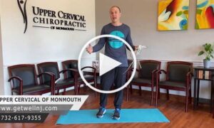 Man talking on exercise mat in waiting room of Upper Cervical Chiropractic of Monmouth NJ
