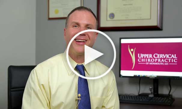 Doctor talking in office of Upper Cervical Chiropractic of Monmouth