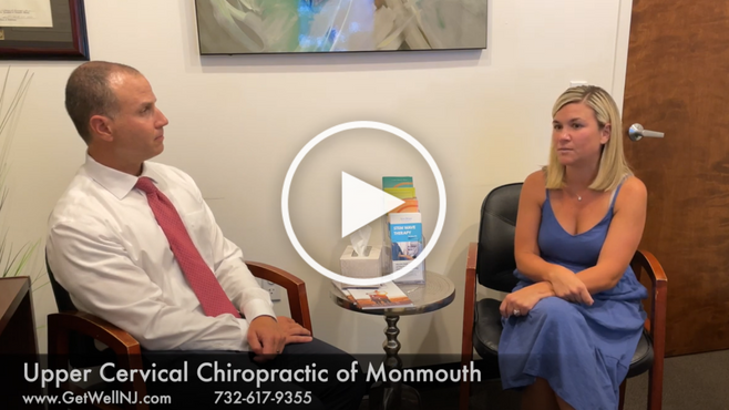 Nicely dressed man and woman sitting in chairs at Upper Cervical Chiropractic of Monmouth